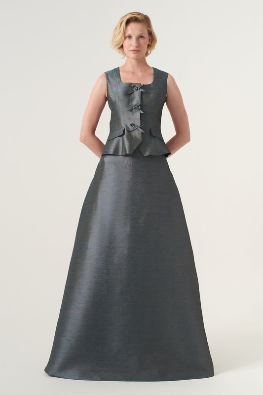 Square collar, ribbon accents, and flap pocket details vest with A-line long skirt